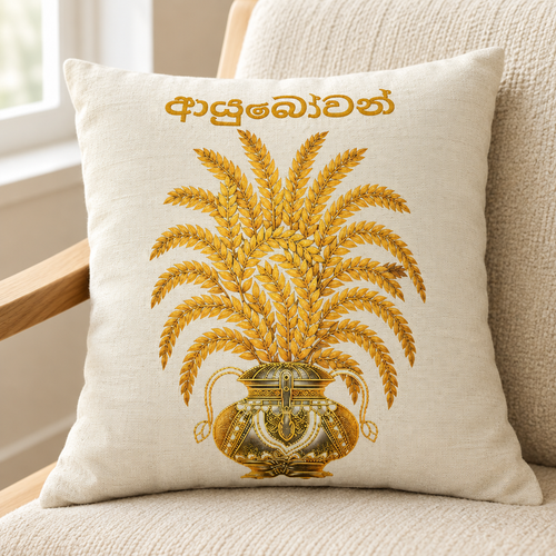 Ivory square pillow with gold paddy stalks, vessel and Sinhala lettering on a cream chair — Ceylon Culture Vibes