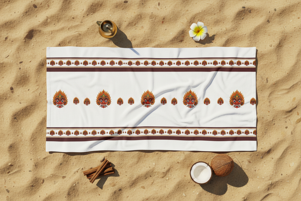 Raksha beach towel with Sri Lankan devil dance mask print in cultural flat lay with brass lamp and frangipani — Raksha Collection — Ceylon Culture Vibes