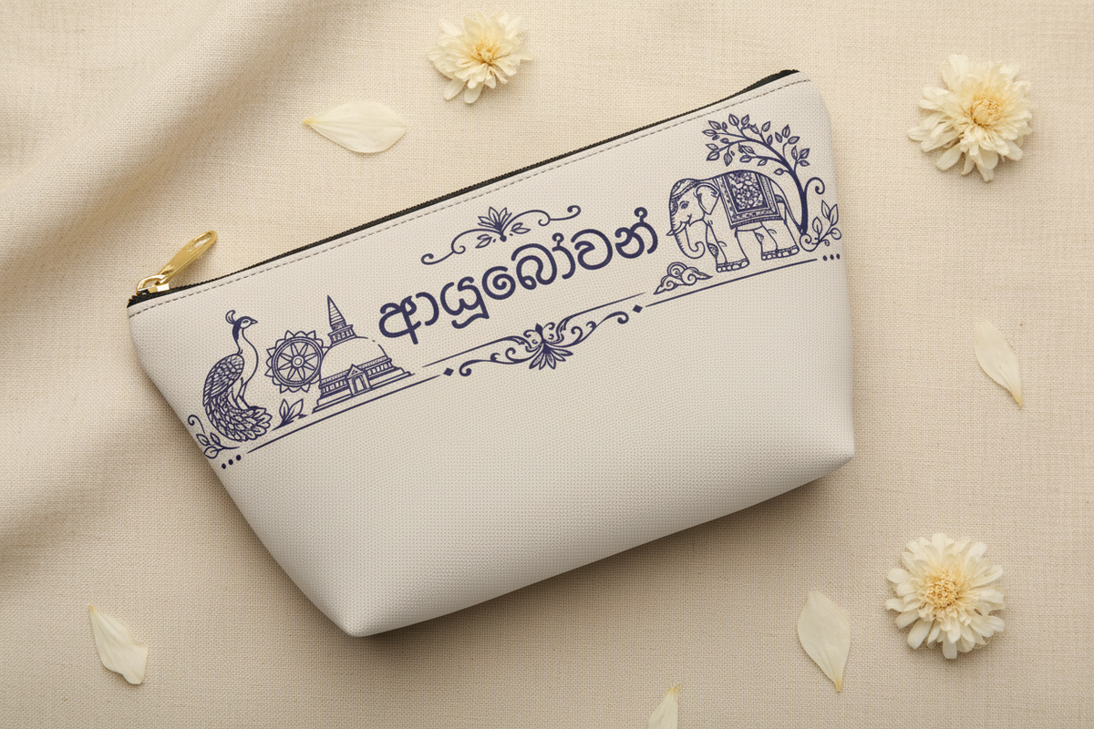 Ayubowan pouch slightly open on cream linen with dried flower petals — Ceylon Culture Vibes
